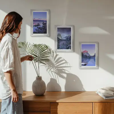 Photo frame wall gallery set with mountain landscapes at dusk and water views