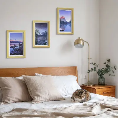 Photo frame wall gallery set with mountain landscapes at dusk and water views
