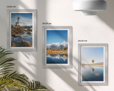 Photo frame wall Views of nature with a lighthouse, mountains, lake and balloon