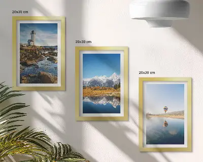 Photo frame wall featuring views of nature with a lighthouse, mountains, lake, and a balloon
