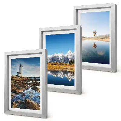 Photo frame wall featuring views of nature with a lighthouse, mountains, lake, and a balloon