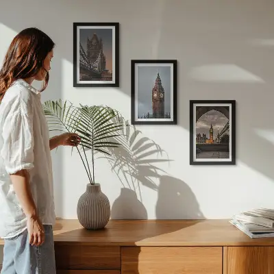 Photo frame wall with views of London featuring the bridge and Big Ben