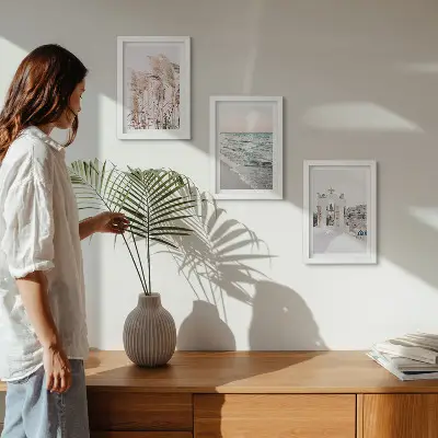 Framed triptych seaside plants and sea waves with a view of white houses