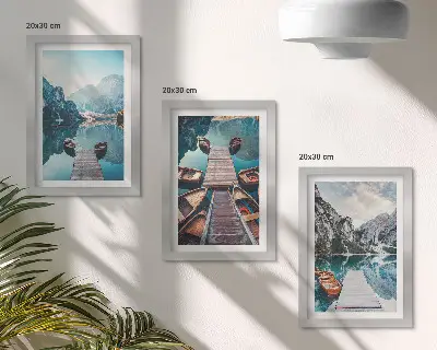 Photo frame wall featuring a calm lake with wooden piers and boats
