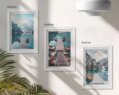 Photo frame wall featuring a calm lake with wooden piers and boats