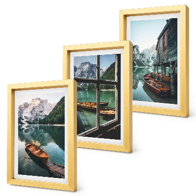 Framed triptych View of a mountain lake with boats and a house by the water