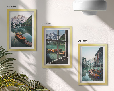 Framed triptych View of a mountain lake with boats and a house by the water