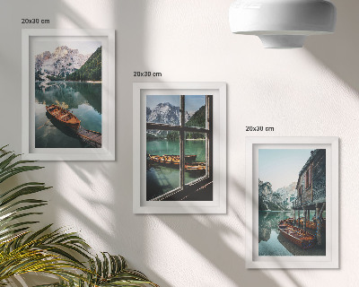 Framed triptych View of a mountain lake with boats and a house by the water