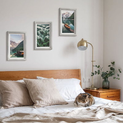 Photo frame wall Mountain landscapes with a lake, a boat, and a forest in the fog