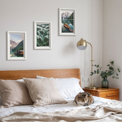 Photo frame wall Mountain landscapes with a lake, a boat, and a forest in the fog