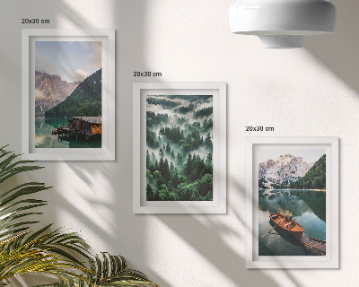 Photo frame wall Mountain landscapes with a lake, a boat, and a forest in the fog