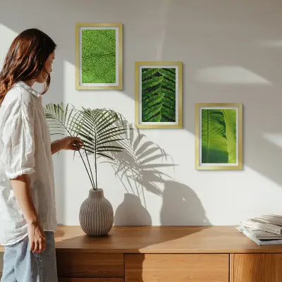 Photo frame wall with close-ups of tropical leaves