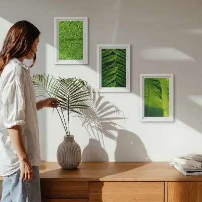 Photo frame wall with close-ups of tropical leaves
