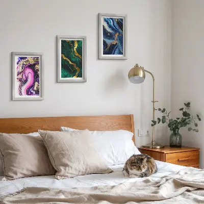 Photo frame wall with abstract patterns in shades of pink, green, and blue