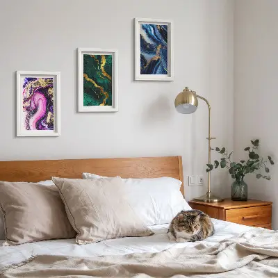 Photo frame wall with abstract patterns in shades of pink, green, and blue