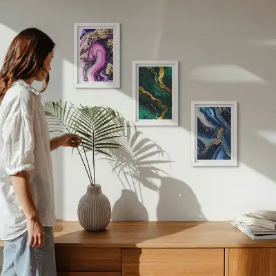 Photo frame wall with abstract patterns in shades of pink, green, and blue