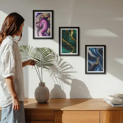 Photo frame wall with abstract patterns in shades of pink, green, and blue