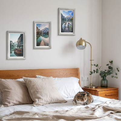 Framed triptych A quiet lake in the mountains with wooden boats