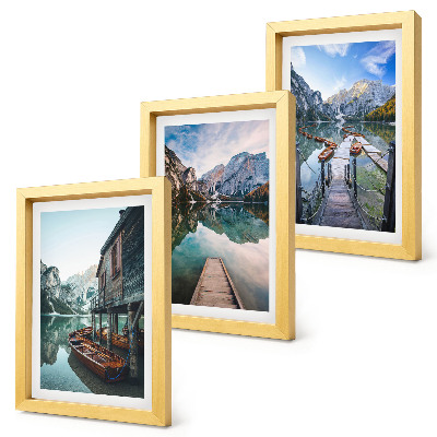 Framed triptych A quiet lake in the mountains with wooden boats