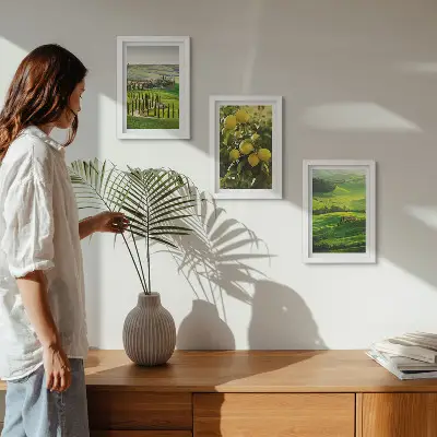 Photo frame wall with Italian landscapes featuring citrus trees and green hills