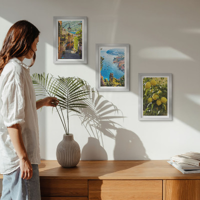 Photo frame wall Picturesque seaside streets with a view of the sea and lemons
