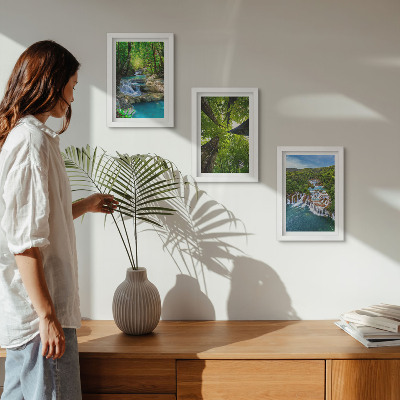 Photo frame wall Waterfalls in a green forest with crystal clear water