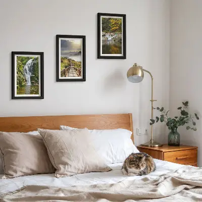 Framed triptych wall art featuring waterfalls, mountains, cloud paths, and autumn views