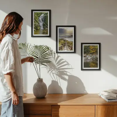 Framed triptych wall art featuring waterfalls, mountains, cloud paths, and autumn views