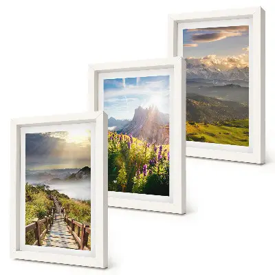 Photo frame wall gallery mountain landscapes featuring flowers, a clear sky, and a path