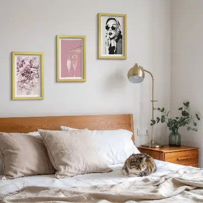 3-piece wall art set featuring flowers in shades of pink and an elegant woman
