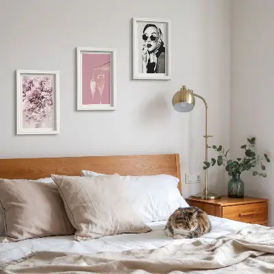 3-piece wall art set featuring flowers in shades of pink and an elegant woman