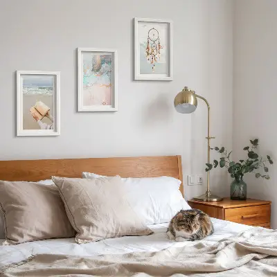 Photo frame wall gallery set with abstract sea, reading book, and boho dream catcher prints