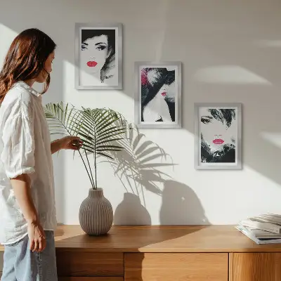 Framed triptych of painted portraits featuring women with expressive lips a set of three framed portraits of women with expressive lips
