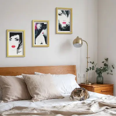 Framed triptych of painted portraits featuring women with expressive lips a set of three framed portraits of women with expressive lips