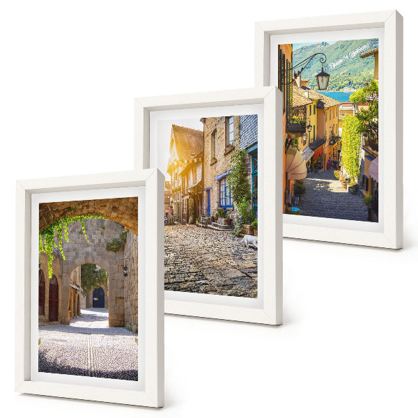 Framed triptych Charming streets with stone buildings and gates