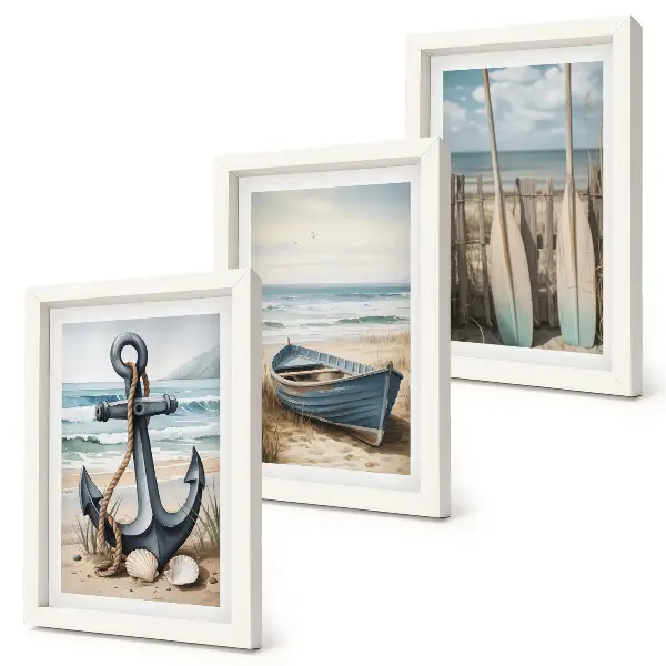 Framed triptych boat anchor and oars on a beach with the sea
