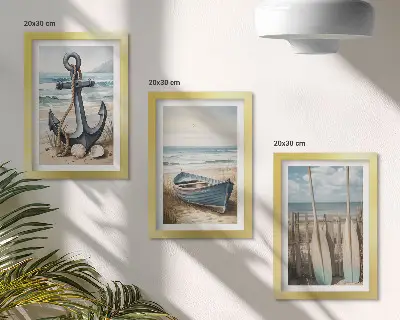 Framed triptych boat anchor and oars on a beach with the sea