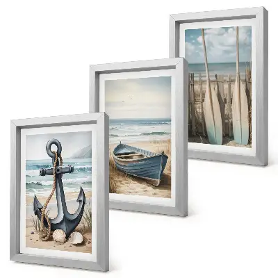 Framed triptych boat anchor and oars on a beach with the sea