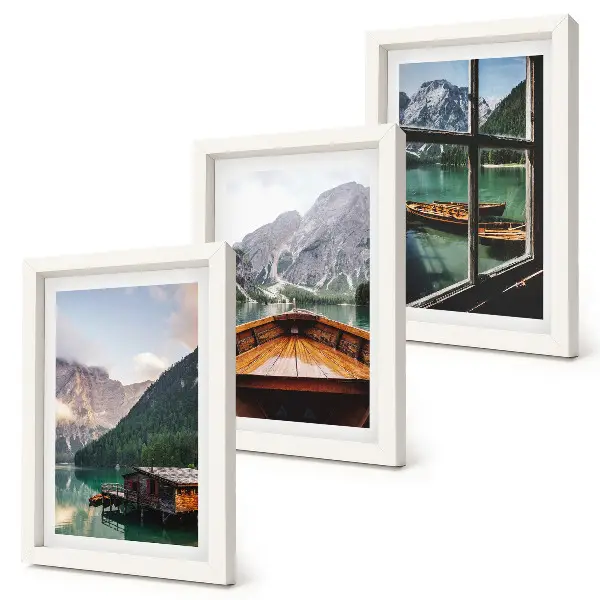 Mountain lake with a boat and wooden houses framed triptych