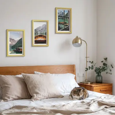 Mountain lake with a boat and wooden houses framed triptych