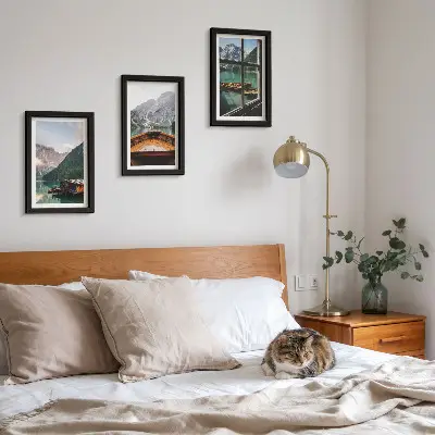 Mountain lake with a boat and wooden houses framed triptych