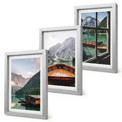Mountain lake with a boat and wooden houses framed triptych