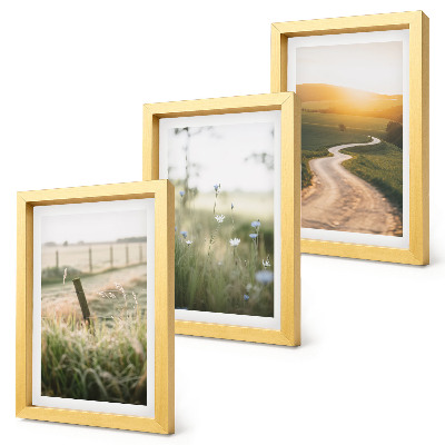 Photo frame wall Landscape with a meadow, road and sunset