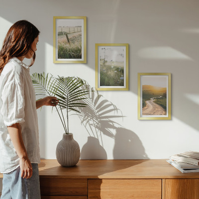 Photo frame wall Landscape with a meadow, road and sunset