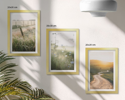 Photo frame wall Landscape with a meadow, road and sunset