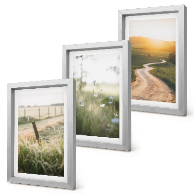 Photo frame wall Landscape with a meadow, road and sunset