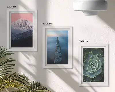 Framed triptych mountains with a pink sky, water, and green succulents