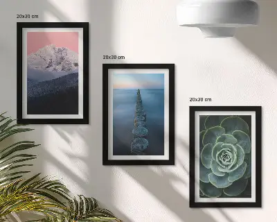 Framed triptych mountains with a pink sky, water, and green succulents