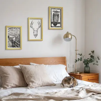 Photo frame wall featuring a graphic Scream-inspired skull and owl illustration