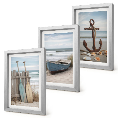 Photo frame wall A beach with a rowboat and an anchor in the sand